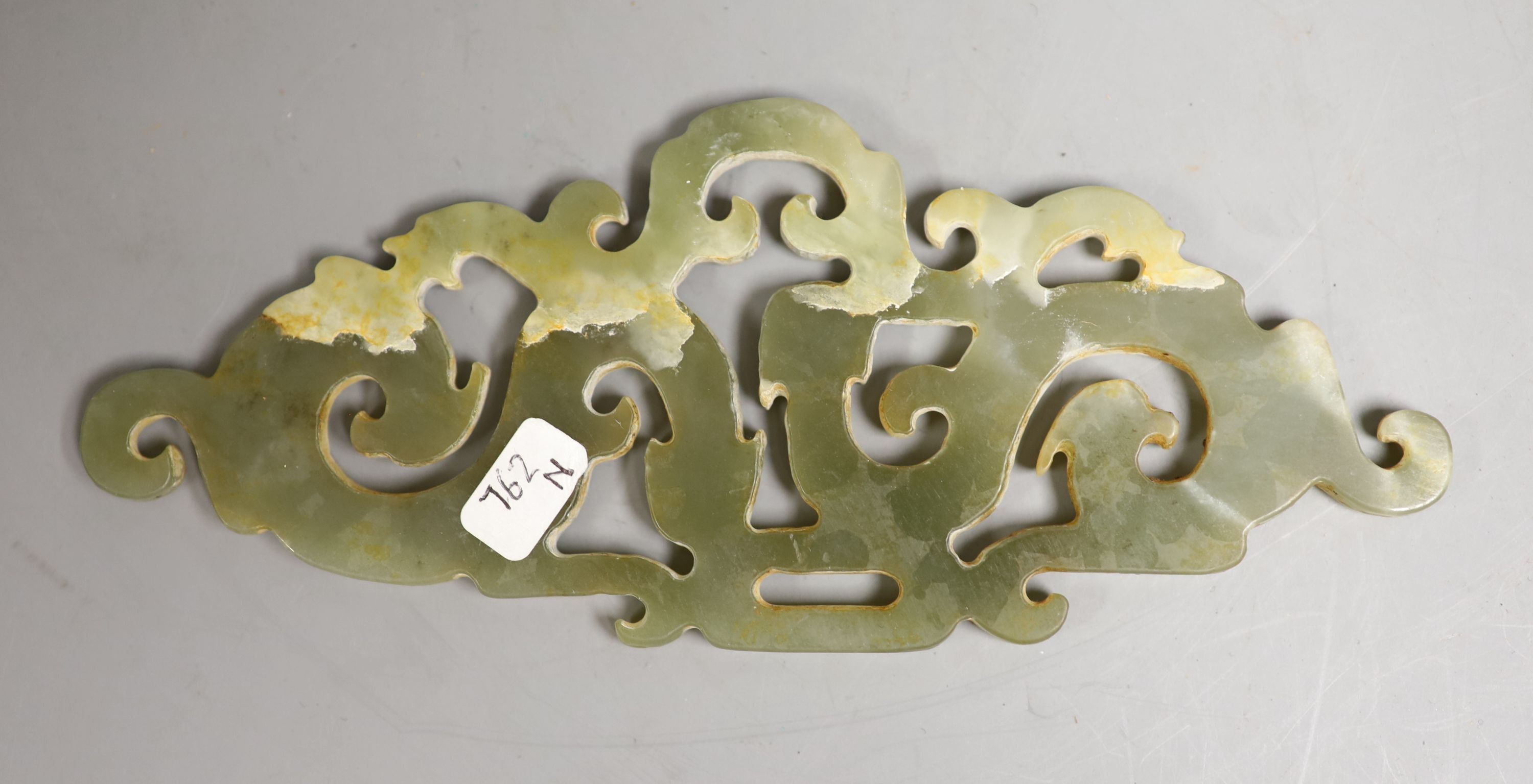 A Chinese celadon jade 'chilong' plaque, 14cm wide